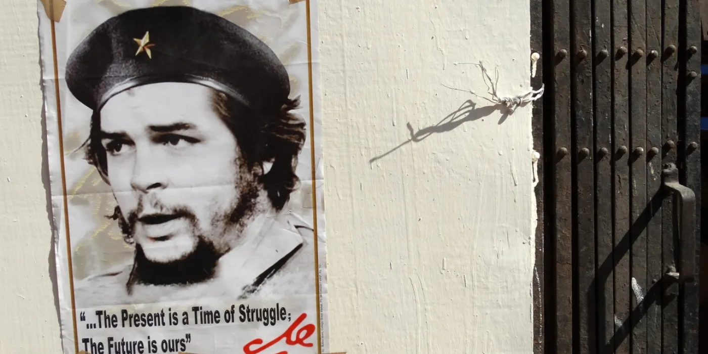 "Facade with Che Guevara Poster - Kolkata Book Fair - Kolkata - India" by Adam Jones, Ph.D. - Global Photo Archive is licensed under CC BY-SA 2.0